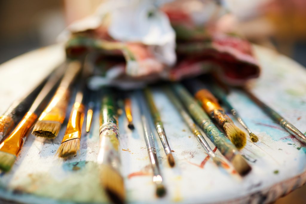 Close up of artist brushes on a palette