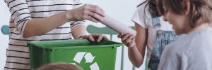 Girl recycling paper tube